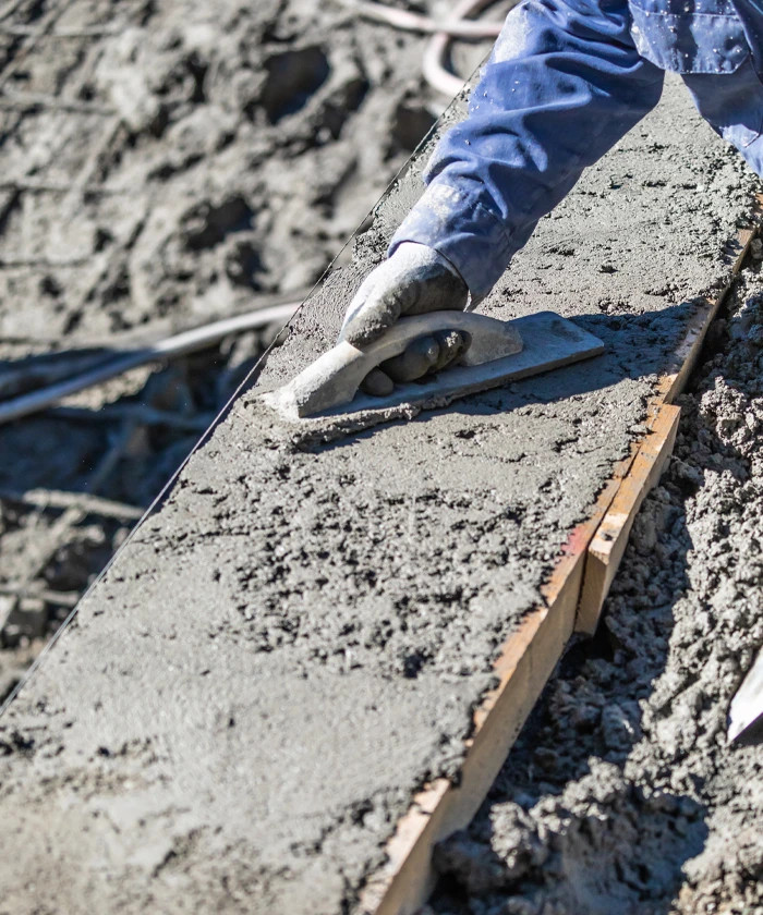 worker smoothing out concrete